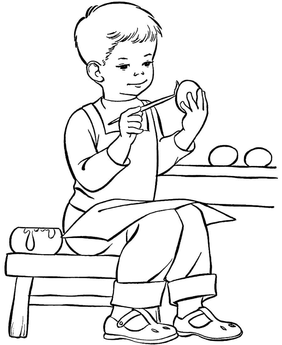 Раскраска Мальчик красит пасхальные яйца