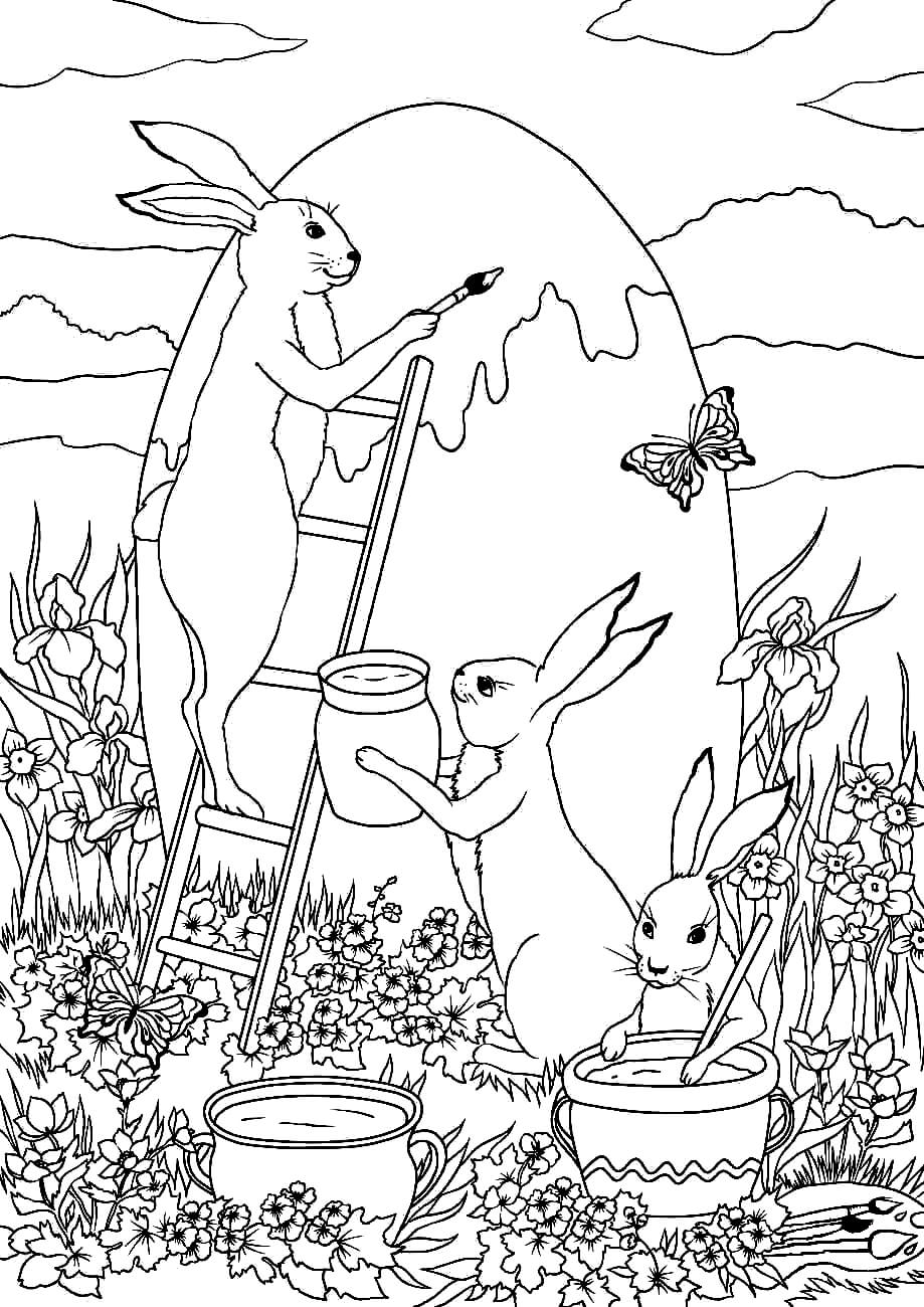 Раскраска Пасхальные кролики красят яйцо